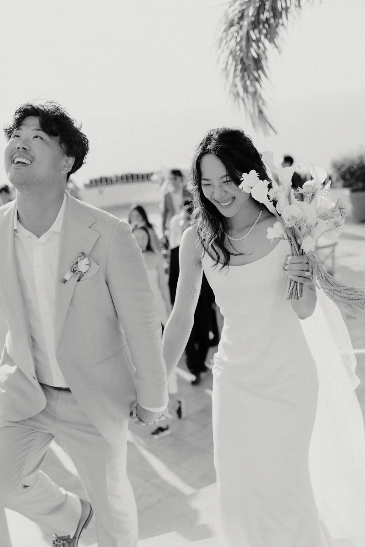 Couple celebrating at their Puerto Vallarta wedding by Evgenia Kostiaeva